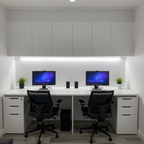 Modern office setup with two desks, chairs, and computer monitors in a well-lit room.