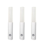 Three white motion sensor lights on a white background