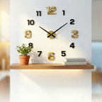Modern wall clock with gold numbers on a white wall above a wooden shelf.
