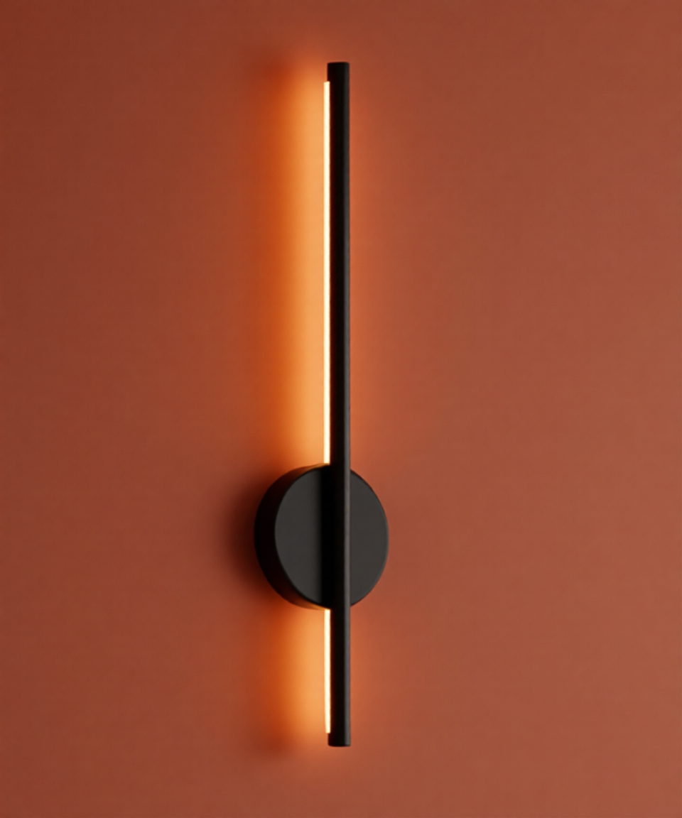 Modern wall light fixture on a warm orange wall