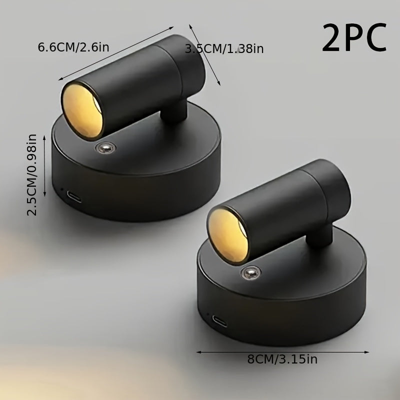 Two black spotlight fixtures with dimensions and a measurement label on a gray background