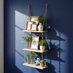 Hanging wooden shelf with plants and framed pictures against a blue wall