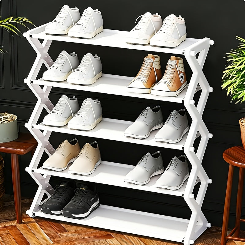 White shoe rack with various shoes on a wooden floor against a black wall.