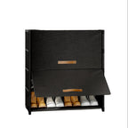 Black shoe storage bench with shoes underneath on a white background