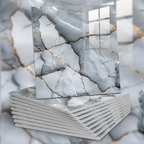 Stack of books with marble-like cover design on a marble surface